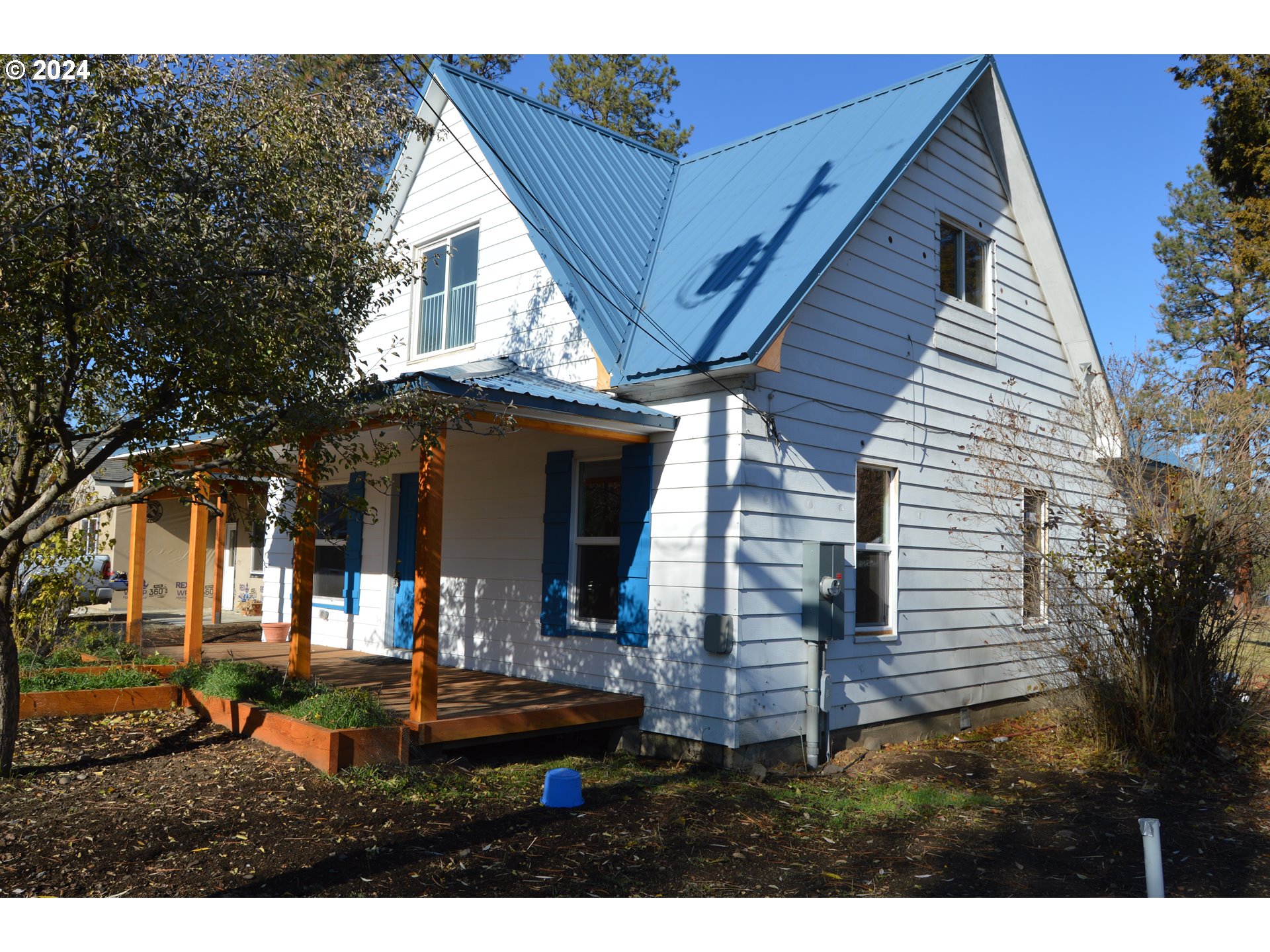 705 Couch Avenue Wallowa, OR 97885 - Photo 33 of 35 a view of house with backyard and glass windows