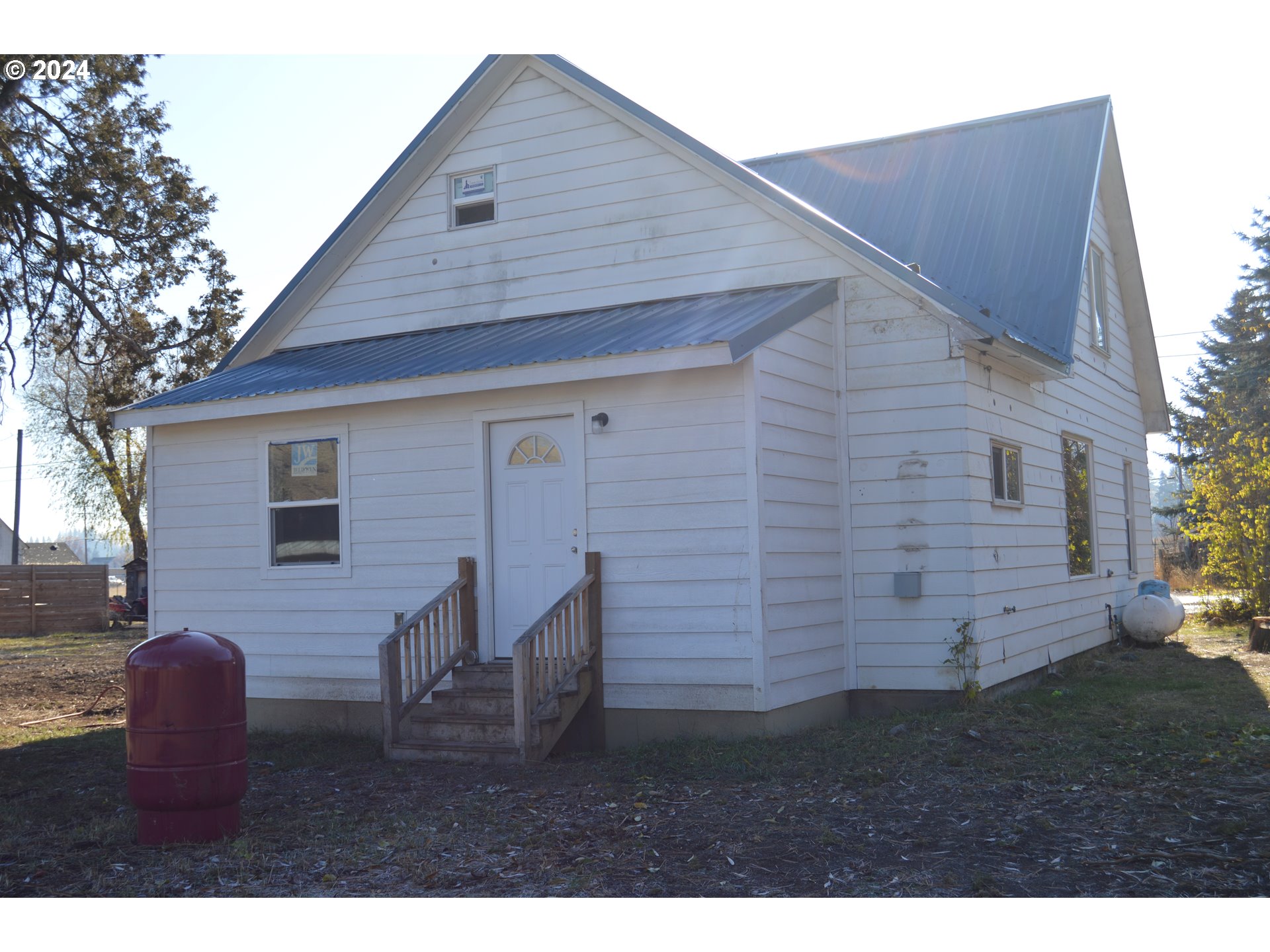 705 Couch Avenue Wallowa, OR 97885 - Photo 34 of 35 a backyard of a house with table and chairs