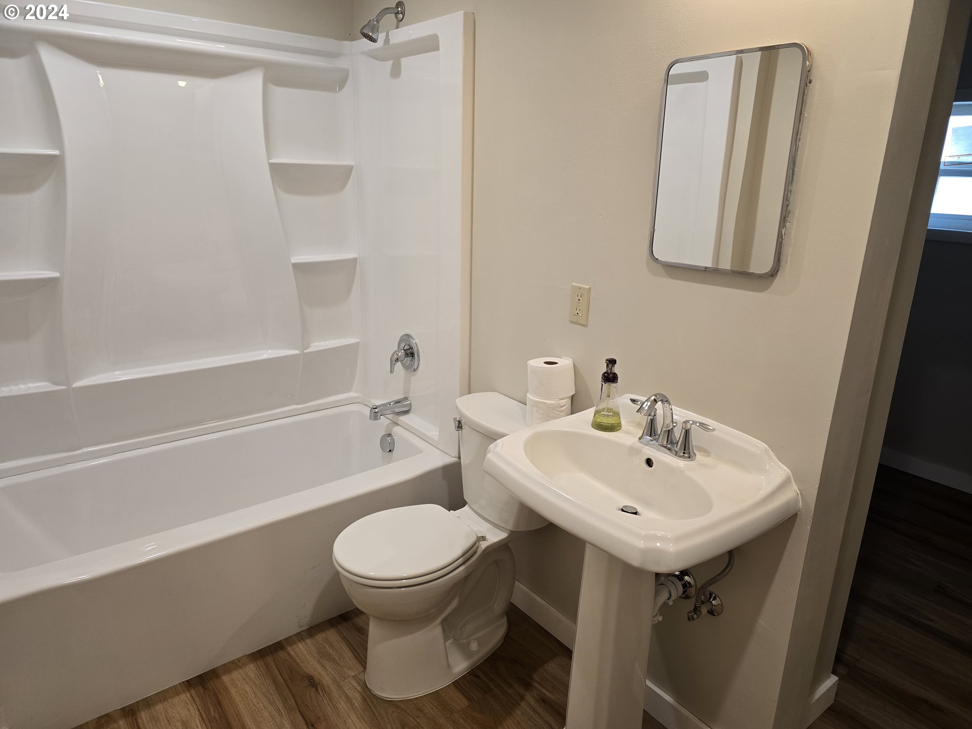705 Couch Avenue Wallowa, OR 97885 - Photo 8 of 35 a bathroom with a sink toilet and shower