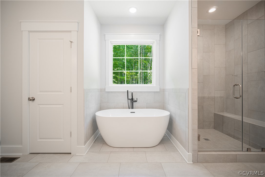 3641 East Rocketts Ridge Road Sandy Hook, VA 23153 - Photo 13 of 17 a bathroom with a bathtub and shower
