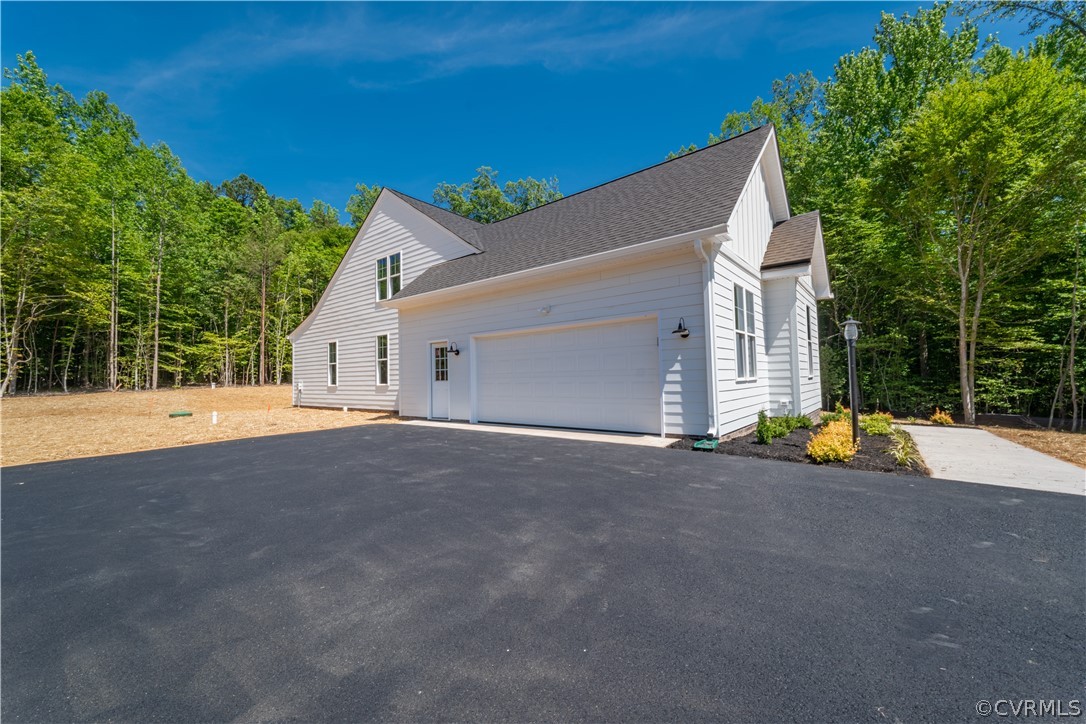 3641 East Rocketts Ridge Road Sandy Hook, VA 23153 - Photo 17 of 17 a view of a house with backyard and a outdoor space