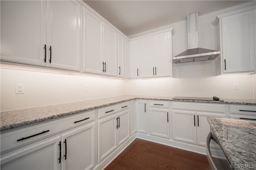 3641 East Rocketts Ridge Road Sandy Hook, VA 23153 - Photo 7 of 17 a kitchen with granite countertop white cabinets and white appliances