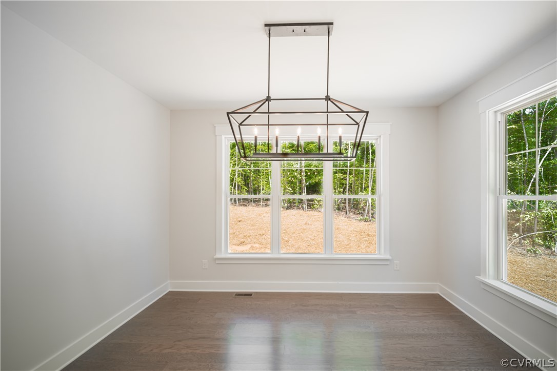 3641 East Rocketts Ridge Road Sandy Hook, VA 23153 - Photo 9 of 17 an empty room with a window