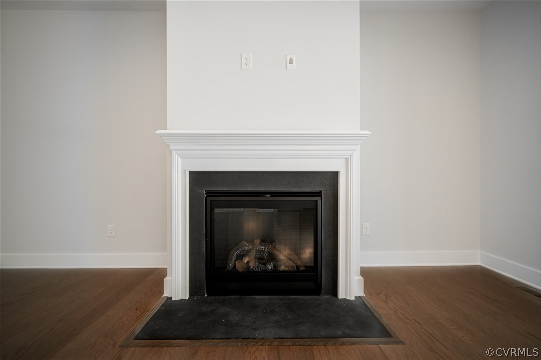 3641 East Rocketts Ridge Road Sandy Hook, VA 23153 - Photo 10 of 17 a living room with a fireplace