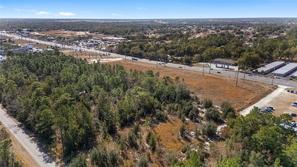 Southeast Maricamp Road Ocala, FL 34472 - Photo 6 of 9 an aerial view of residential houses with outdoor space and trees