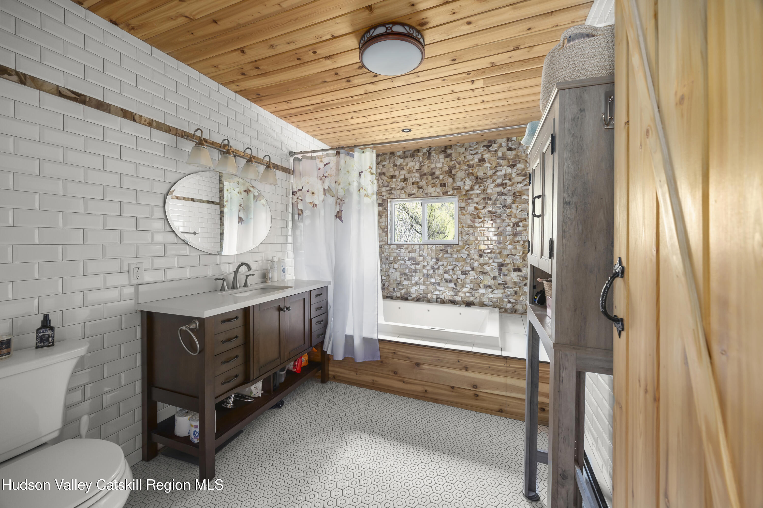 16 Robin Road Copake, NY 12521 - Photo 13 of 23 a bathroom with a tub a sink and a mirror