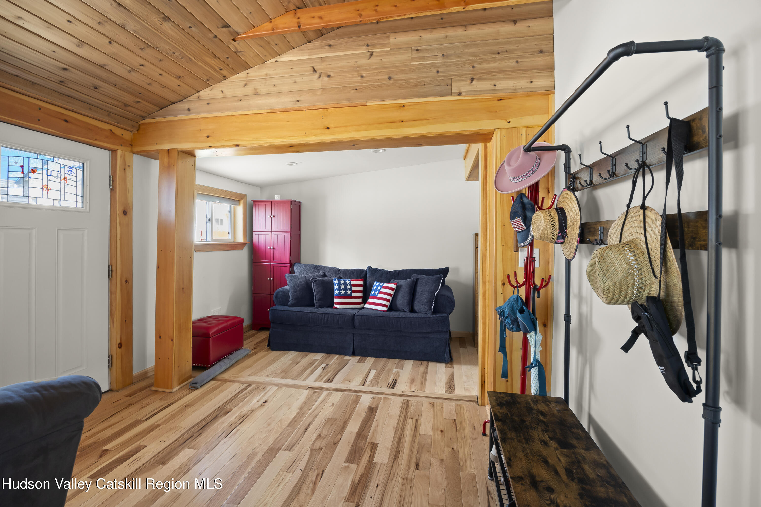 16 Robin Road Copake, NY 12521 - Photo 8 of 23 a bedroom with a bed and a mirror