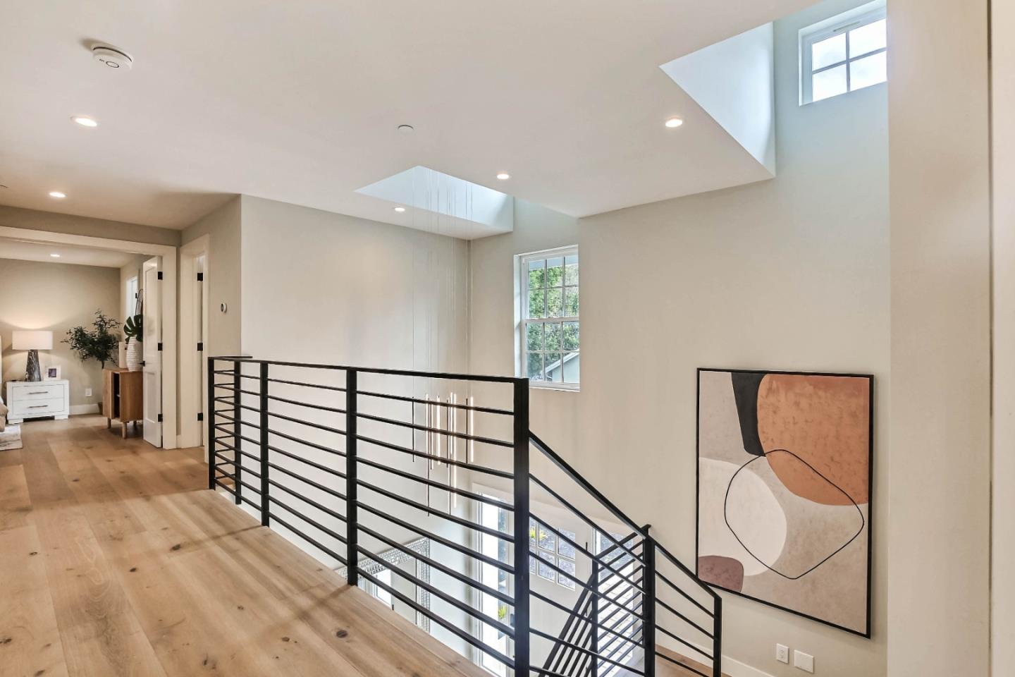 269 Willow Road Menlo Park, CA 94025 - Photo 20 of 26 a view of a hallway with wooden floor