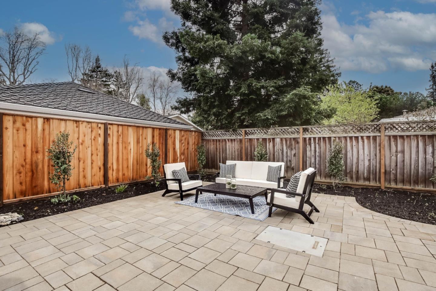 269 Willow Road Menlo Park, CA 94025 - Photo 26 of 26 a backyard of a house with table and chairs