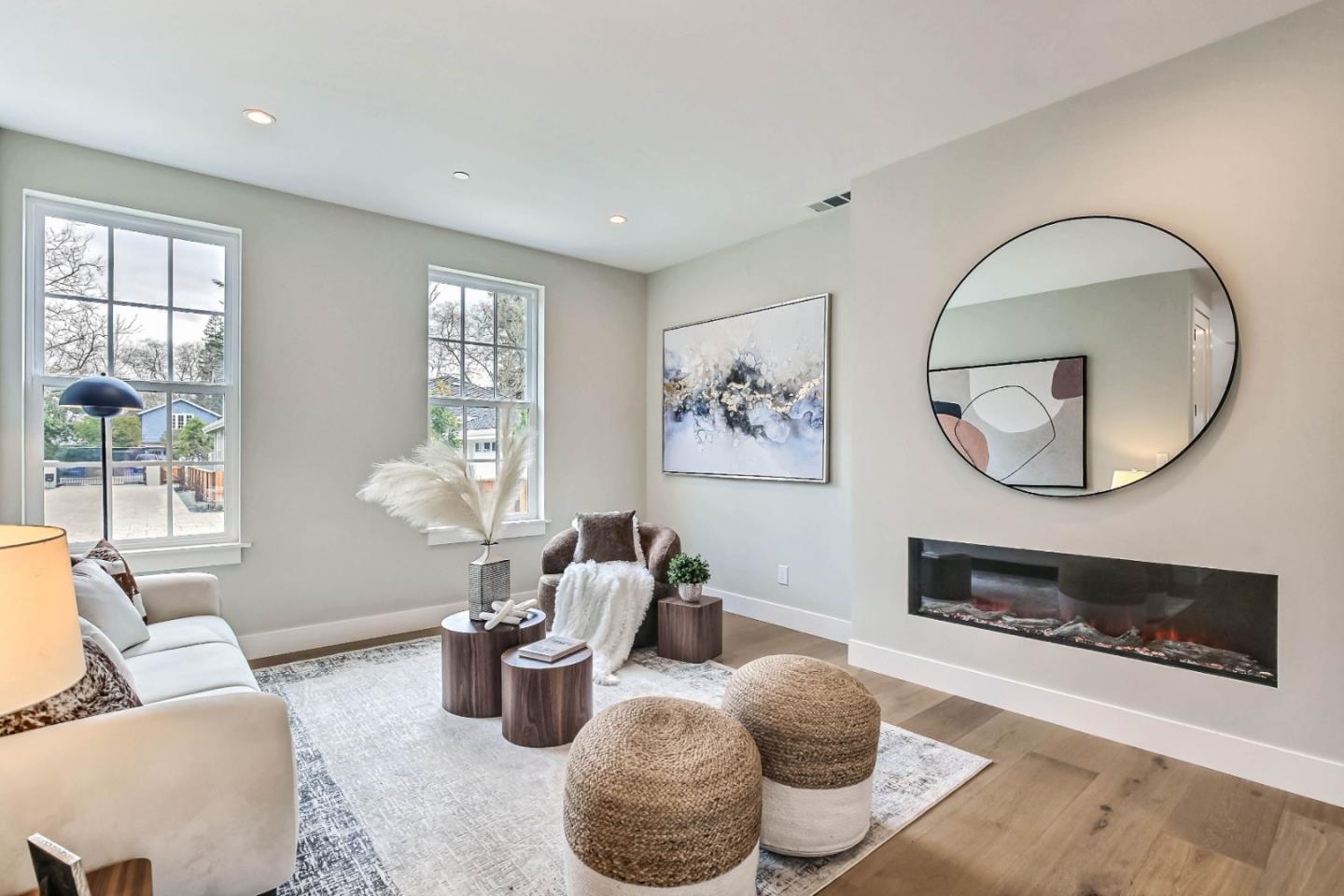 269 Willow Road Menlo Park, CA 94025 - Photo 3 of 26 a living room with furniture a mirror and a large window