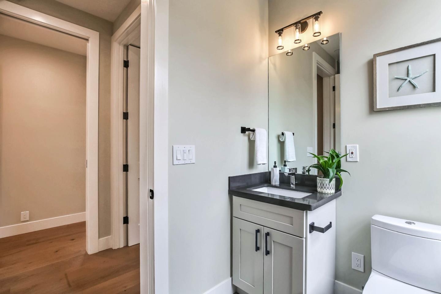 269 Willow Road Menlo Park, CA 94025 - Photo 9 of 26 a bathroom with a sink vanity and a mirror