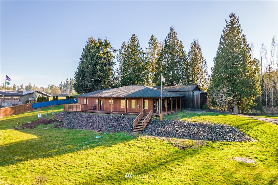 3116 Jackson Highway Chehalis, WA 98532 - Photo 1 of 40 a front view of a house with garden