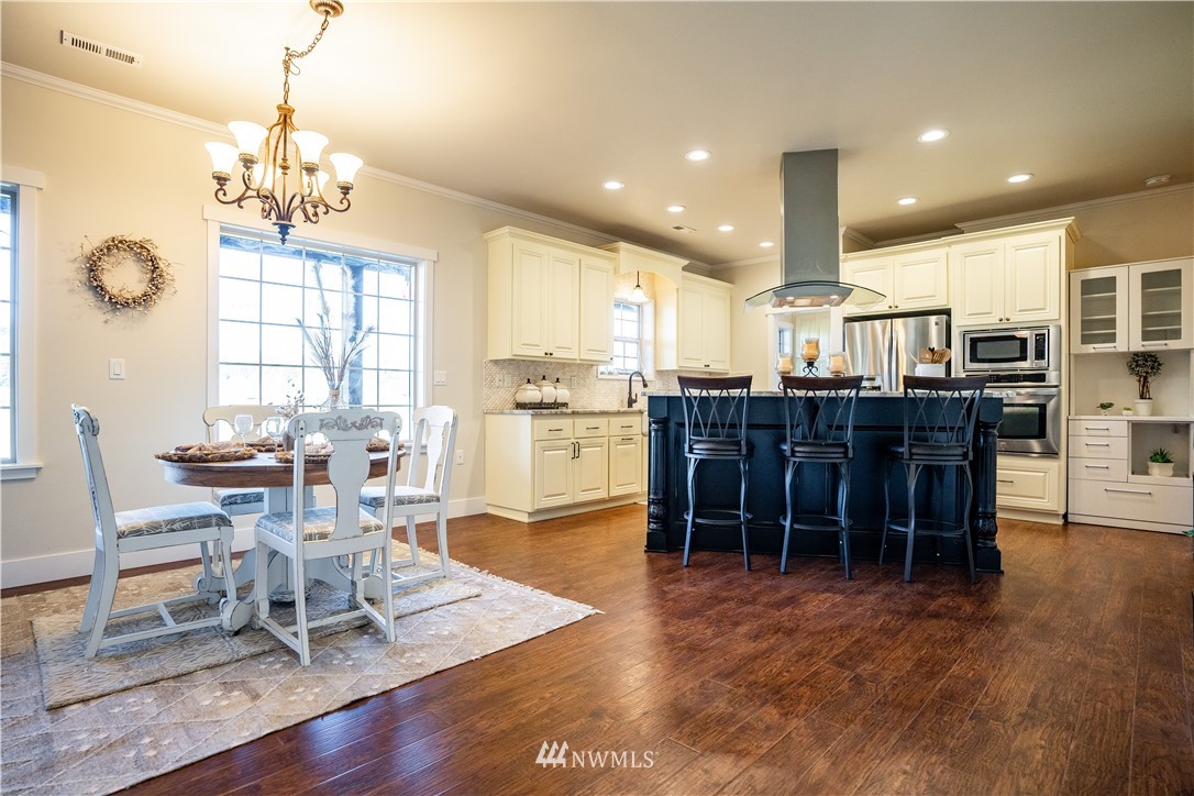 3116 Jackson Highway Chehalis, WA 98532 - Photo 12 of 40 a room with lots of chairs and dining table