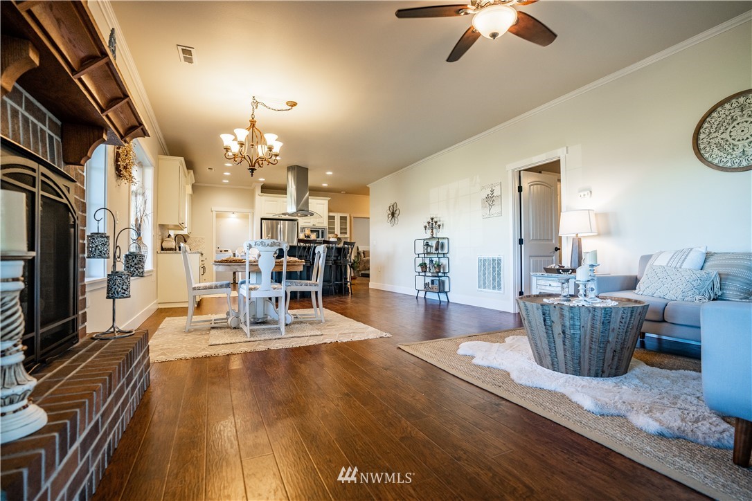 3116 Jackson Highway Chehalis, WA 98532 - Photo 17 of 40 a view of a dining room with furniture a chandelier and wooden floor