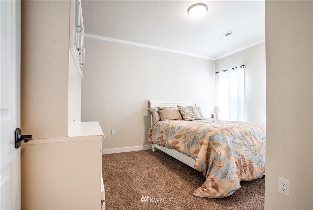 3116 Jackson Highway Chehalis, WA 98532 - Photo 25 of 40 a bedroom with a bed and a window