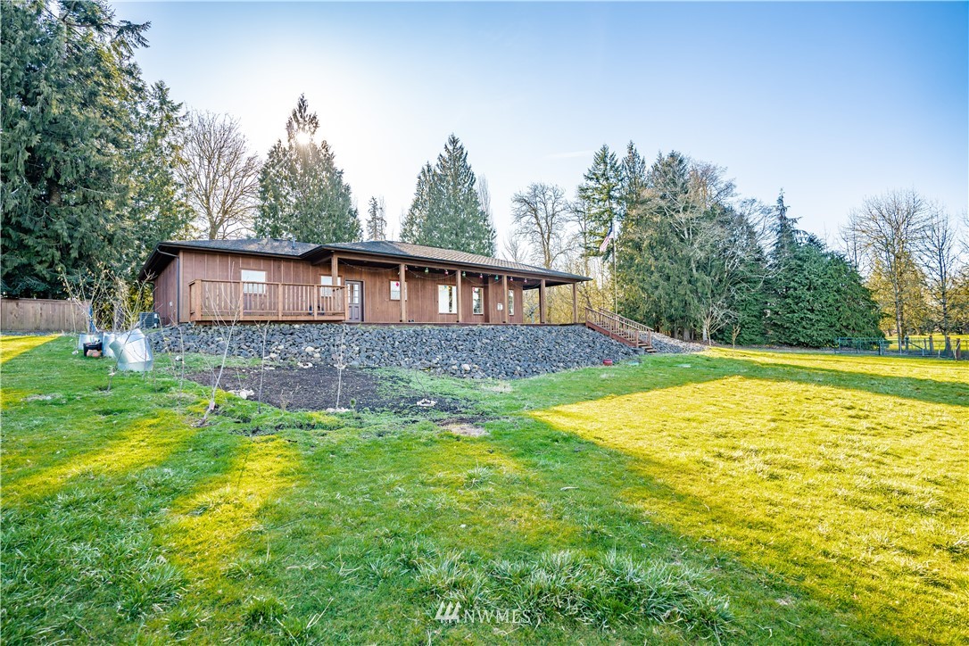 3116 Jackson Highway Chehalis, WA 98532 - Photo 28 of 40 a view of a house with pool and a yard