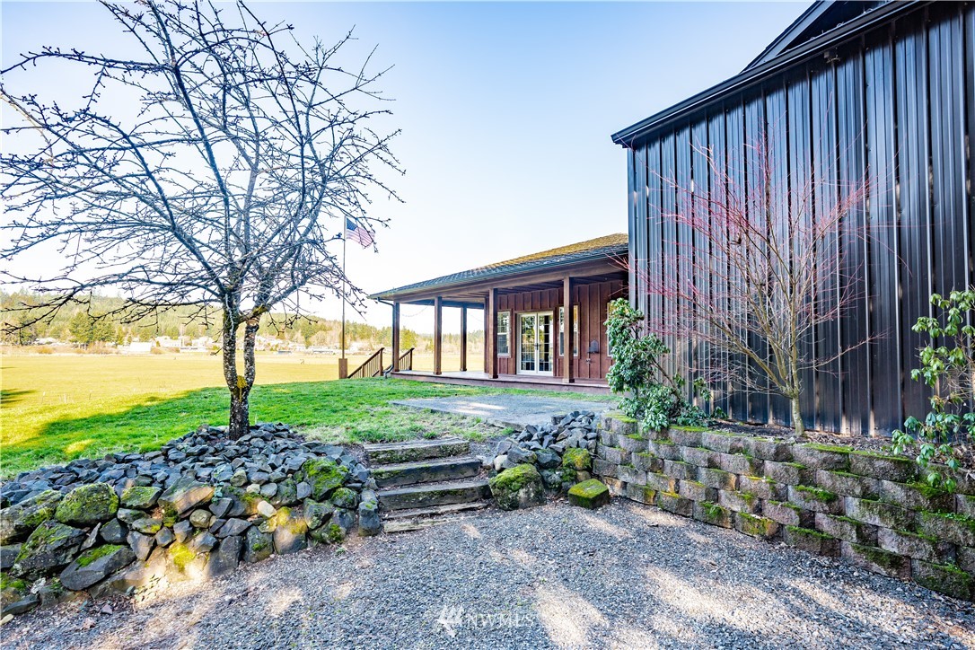 3116 Jackson Highway Chehalis, WA 98532 - Photo 32 of 40 a backyard of a house with lots of green space