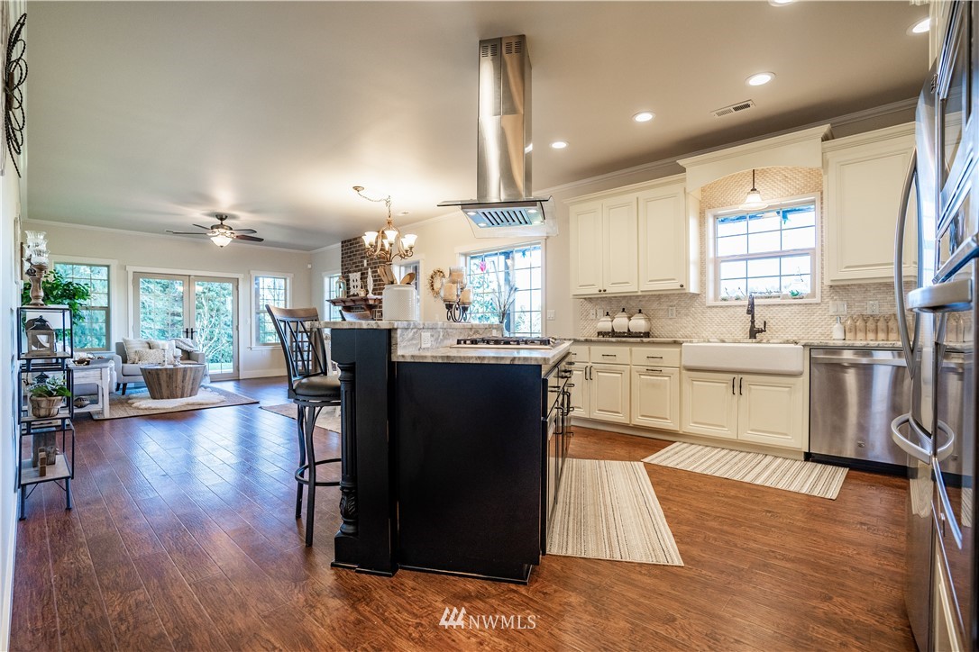 3116 Jackson Highway Chehalis, WA 98532 - Photo 5 of 40 a kitchen with counter top space a sink appliances and cabinets