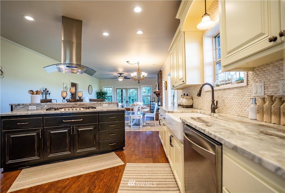 3116 Jackson Highway Chehalis, WA 98532 - Photo 9 of 40 a kitchen with stainless steel appliances granite countertop a sink stove and cabinets