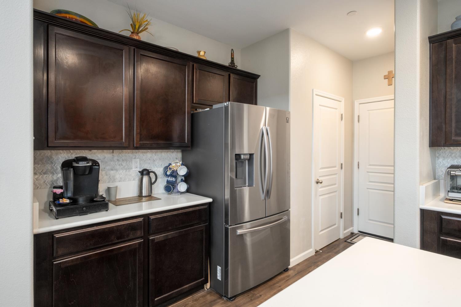 153 Drake Street Madera, CA 93638 - Photo 11 of 34 a kitchen with stainless steel appliances granite countertop a refrigerator and a sink