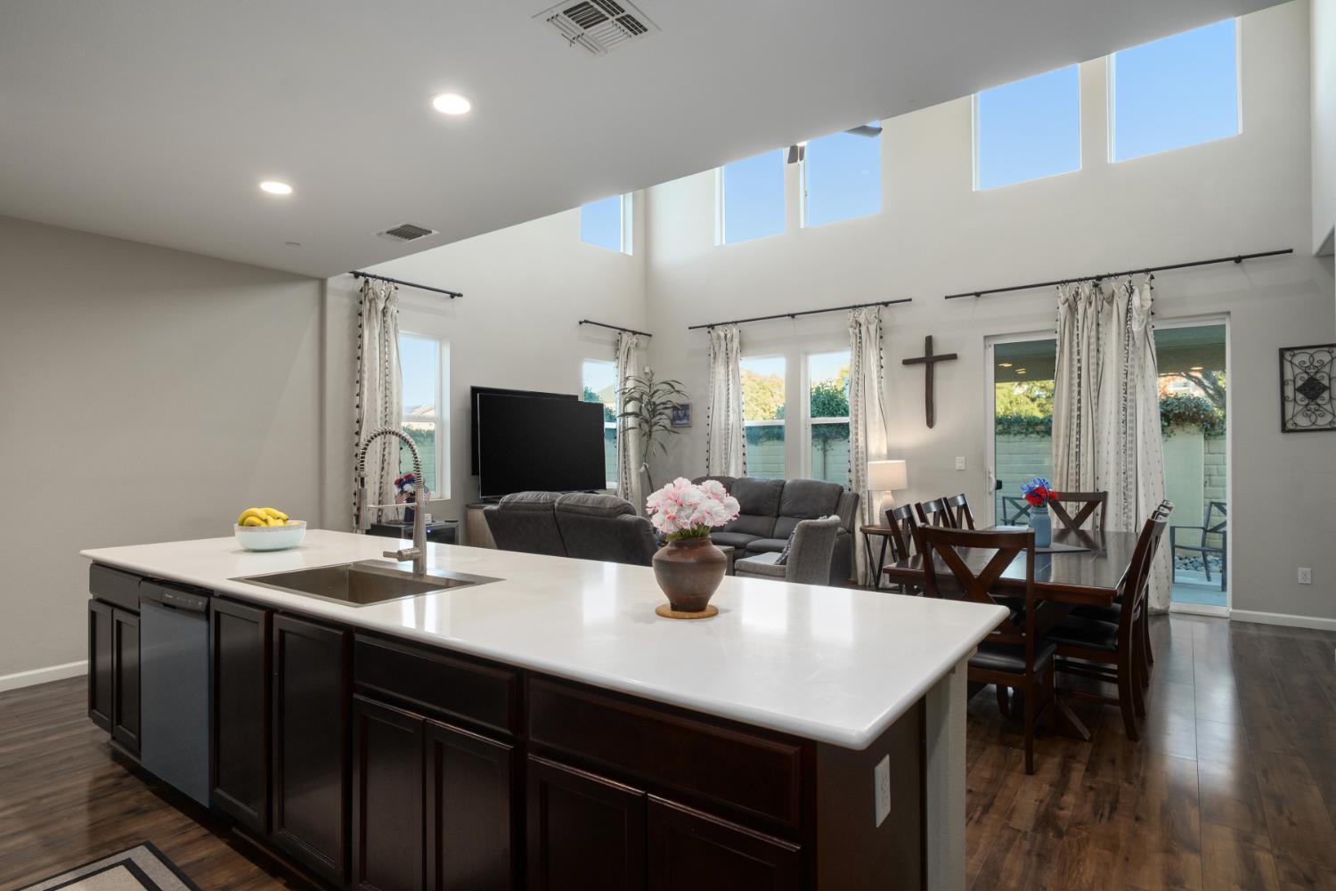 153 Drake Street Madera, CA 93638 - Photo 12 of 34 a kitchen with a table chairs and wooden floor