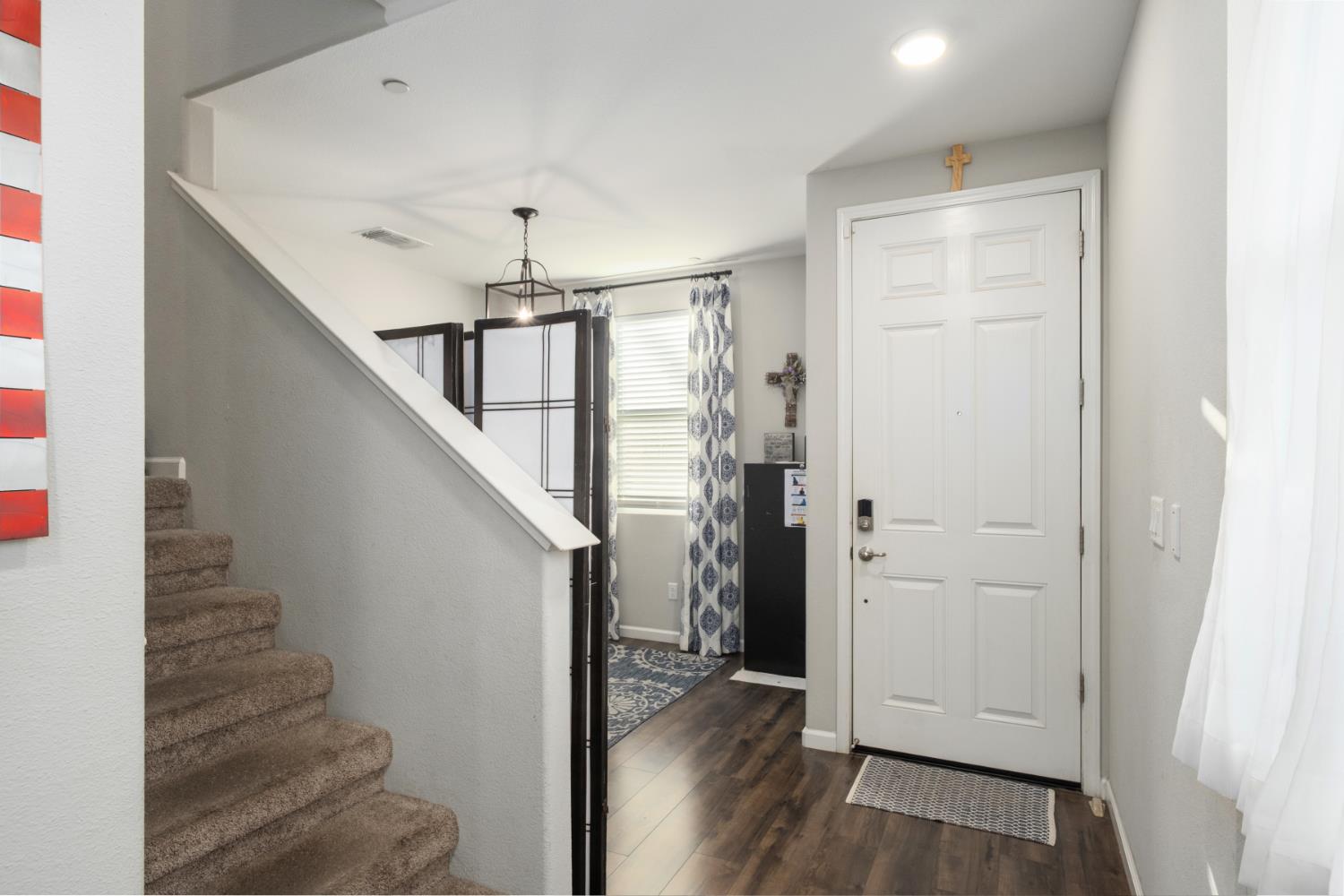 153 Drake Street Madera, CA 93638 - Photo 17 of 34 a view of entryway with wooden floor and stair