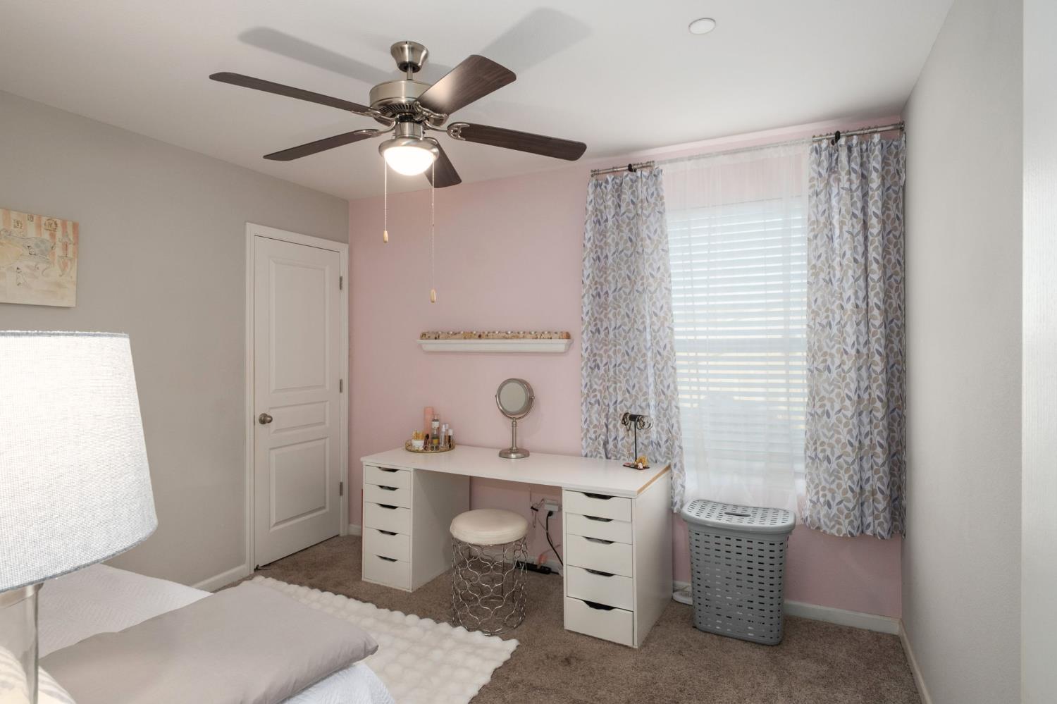 153 Drake Street Madera, CA 93638 - Photo 22 of 34 a bathroom with a sink toilet a mirror and shower