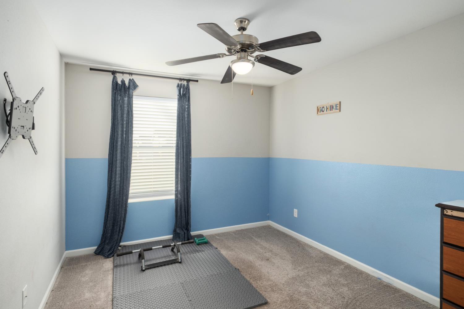 153 Drake Street Madera, CA 93638 - Photo 23 of 34 a view of room with a ceiling fan