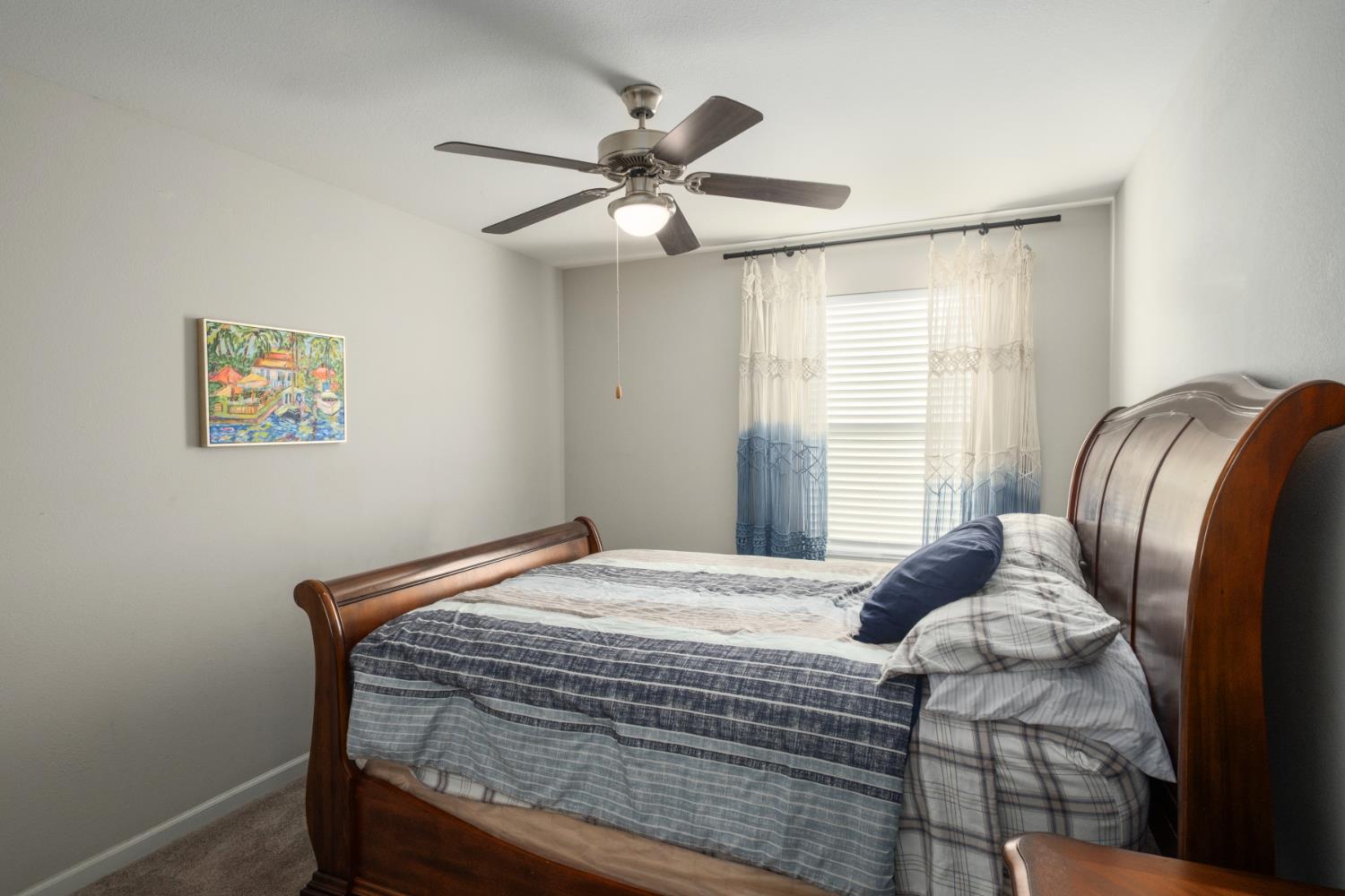 153 Drake Street Madera, CA 93638 - Photo 24 of 34 a bedroom with a bed and a window