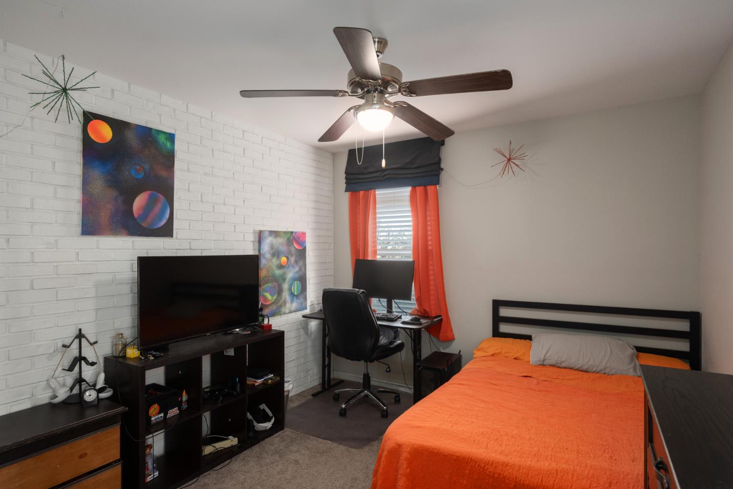 153 Drake Street Madera, CA 93638 - Photo 28 of 34 a room with furniture and flat screen tv