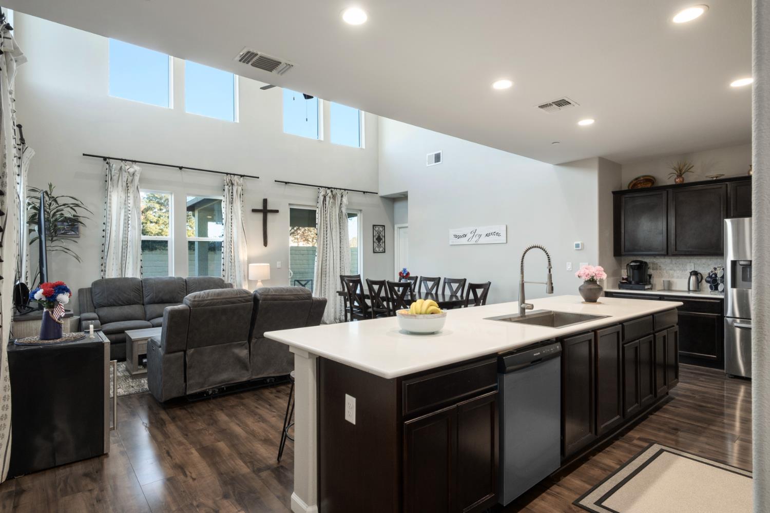 153 Drake Street Madera, CA 93638 - Photo 4 of 34 a kitchen with a sink appliances and cabinets