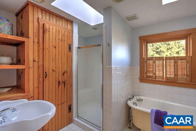 863 Lotts Road Middlebrook, VA 24459 - Photo 17 of 42 a bathroom with a tub and a sink