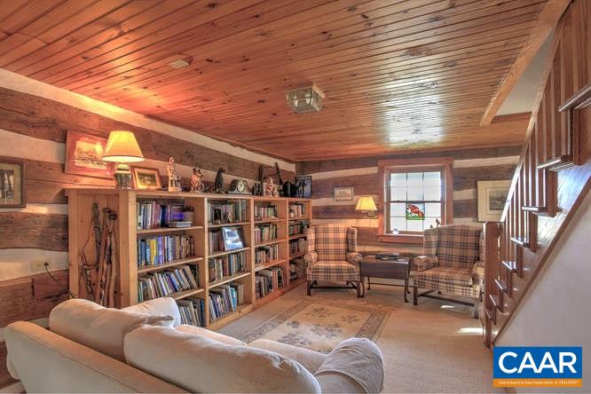 863 Lotts Road Middlebrook, VA 24459 - Photo 5 of 42 a living room with furniture and a book shelf