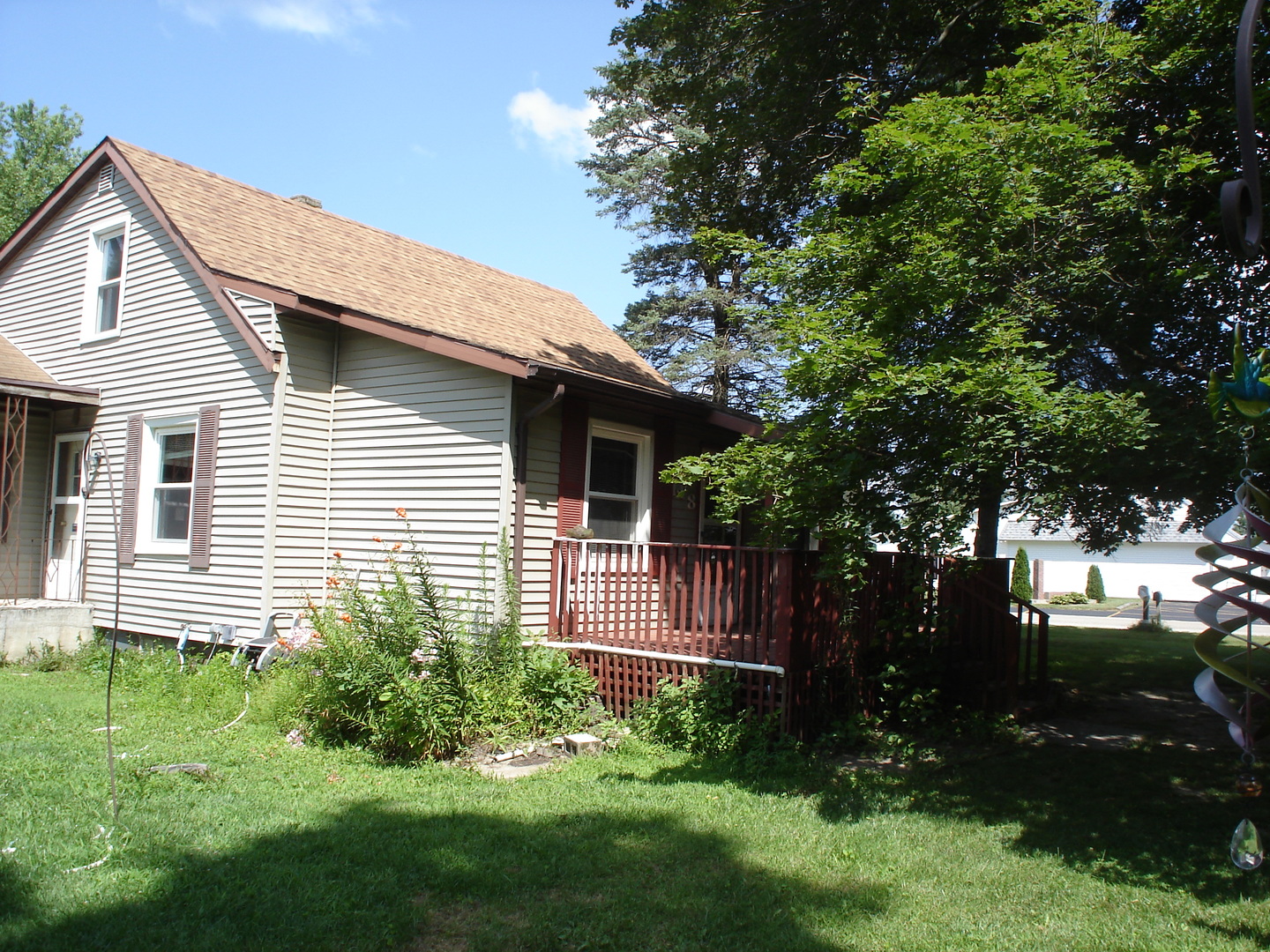 148 Wayne Road Rochelle, IL 61068 - Photo 3 of 17 a front view of a house with a yard and outdoor seating