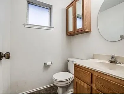 a bathroom with a sink a toilet and a bathtub