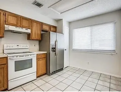 a kitchen with a stove a washer and dryer