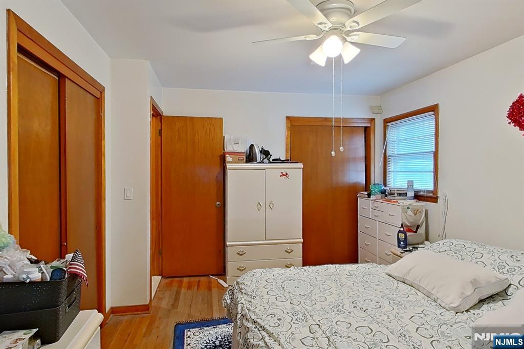 311 Marvin Avenue Hackensack, NJ 07601 - Photo 38 of 39 a bedroom with a bed and a chandelier