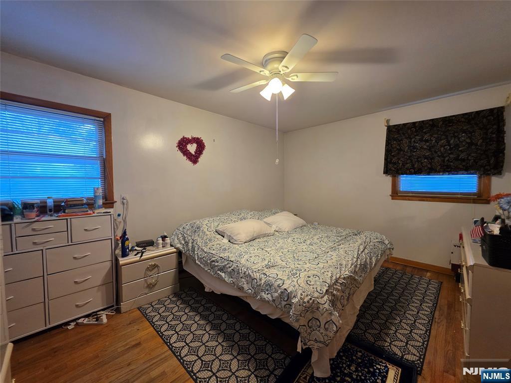 311 Marvin Avenue Hackensack, NJ 07601 - Photo 7 of 39 a bedroom with a bed and a chandelier