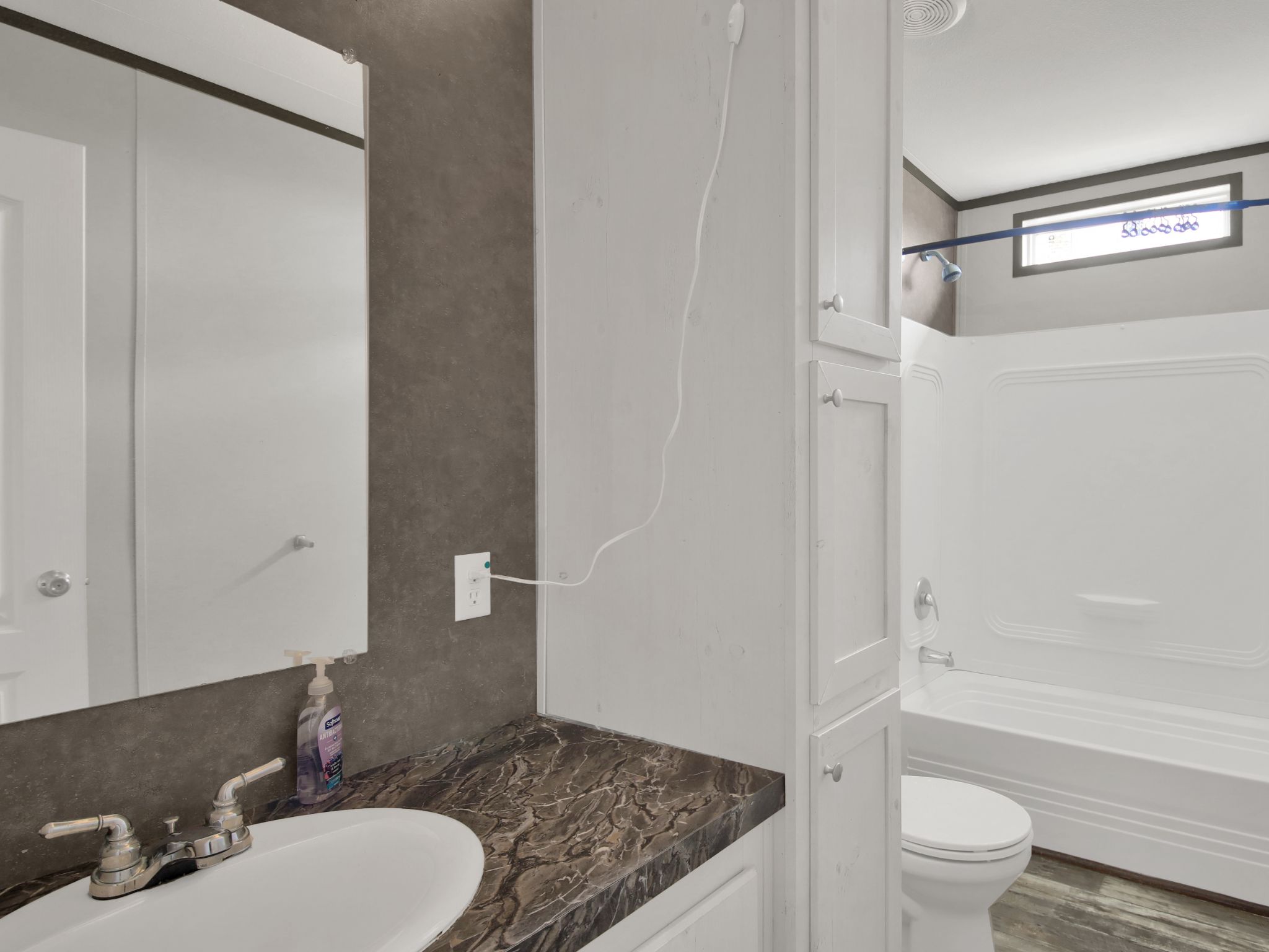 271 Alma Lane Kyle, TX 78640 - Photo 9 of 25 a bathroom with a granite countertop sink toilet and shower