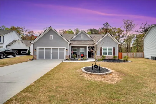 a view of a patio with table and chairs and potted plants