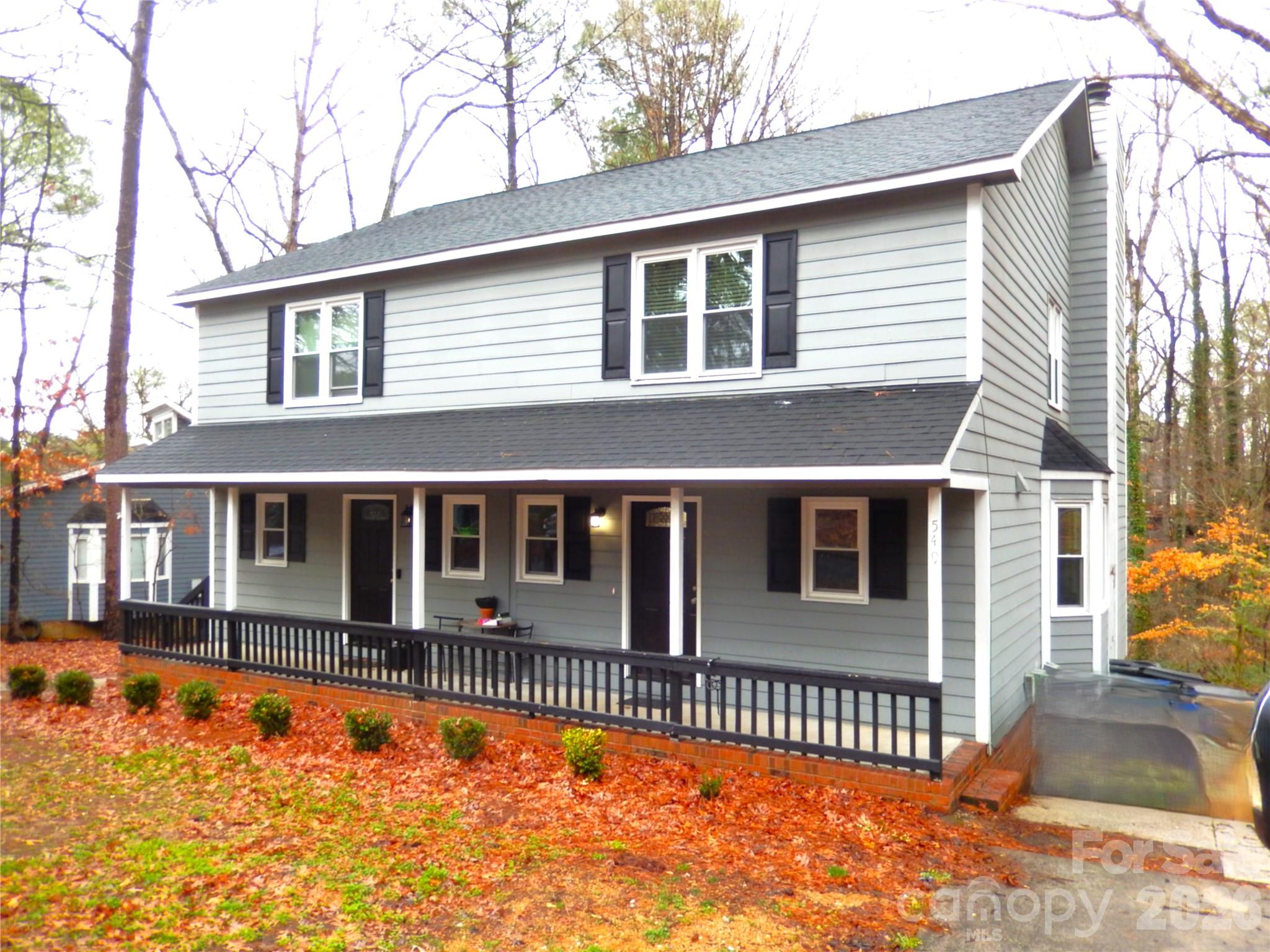 front view of a house with a swimming pool