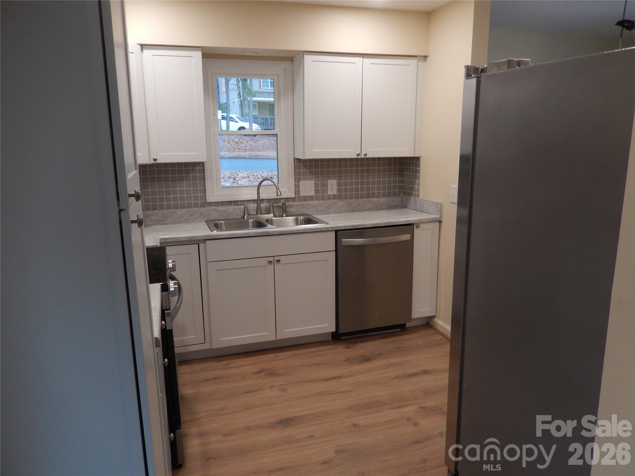 547 Brent Road Raleigh, NC 27606 - Photo 5 of 15 a bathroom with a sink and a mirror