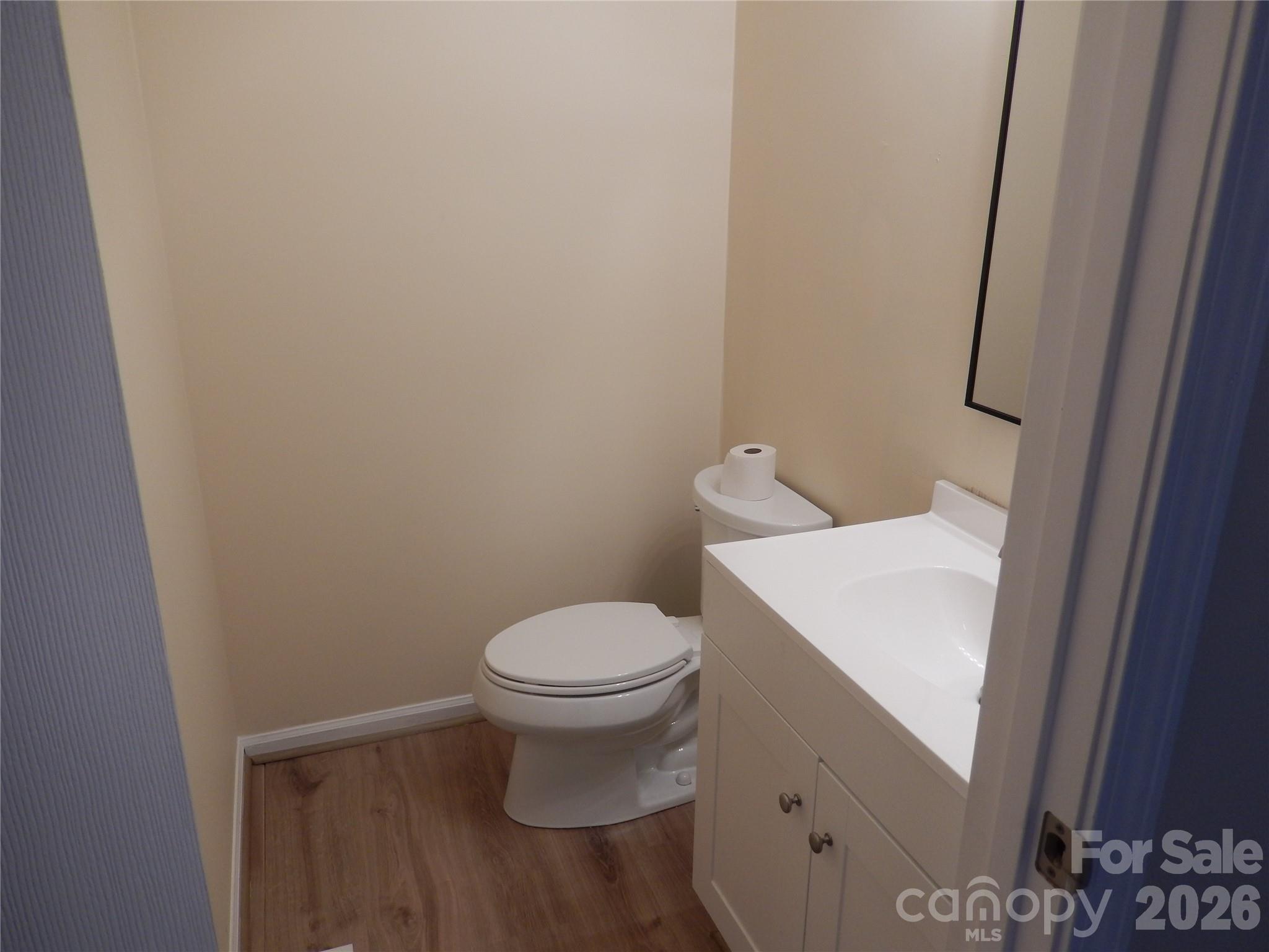 547 Brent Road Raleigh, NC 27606 - Photo 6 of 15 a white toilet sitting next to a white sink