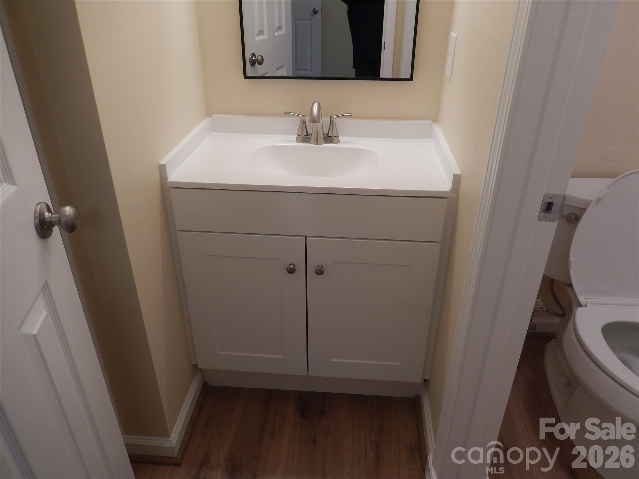 547 Brent Road Raleigh, NC 27606 - Photo 9 of 15 a bathroom with a sink and mirror