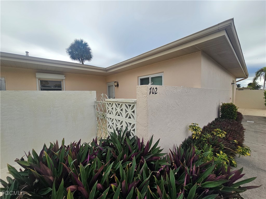 a vase of flowers sitting on a floor
