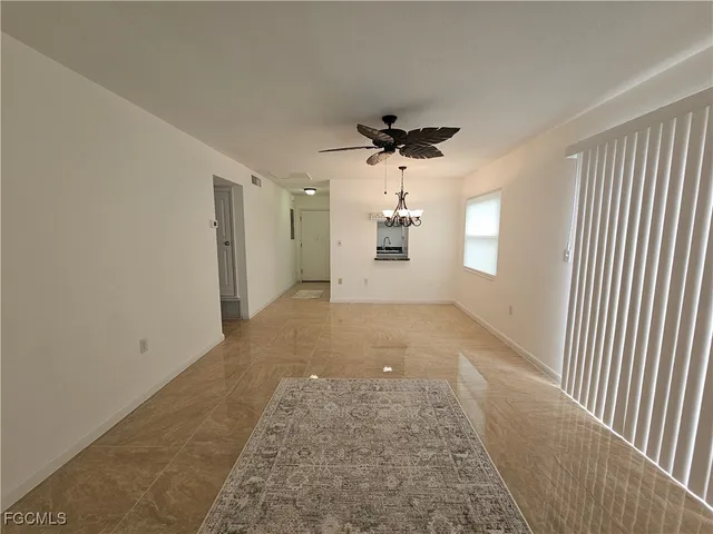 a kitchen with a stove and a window