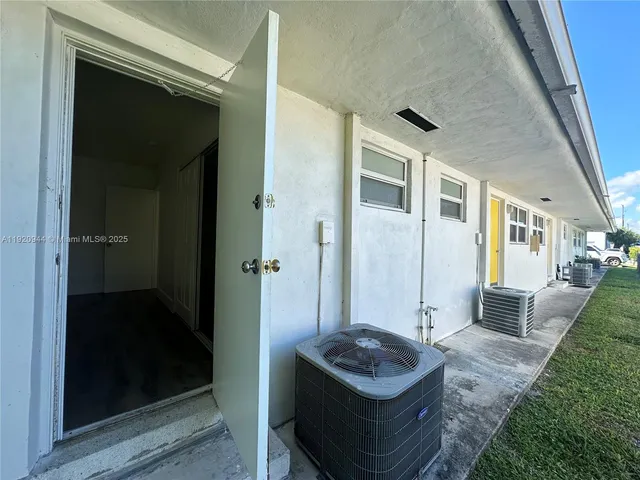 a living room with furniture and a gate