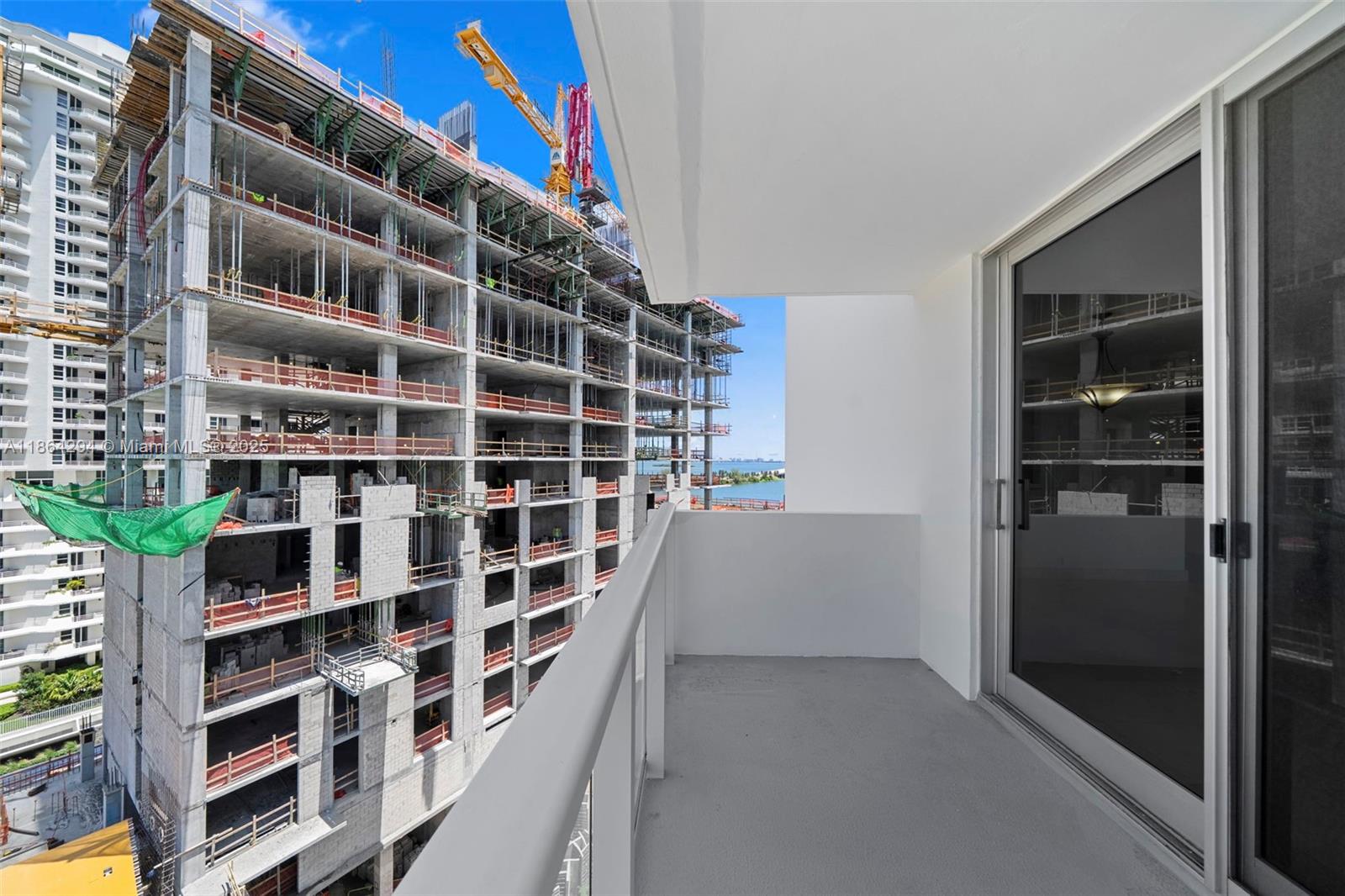 3301 Northeast 5th Avenue, Unit 1018 Miami, FL 33137 - Photo 20 of 24 a view of walk in closet with clothes and shoes