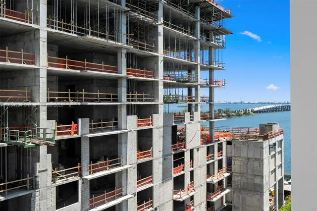 a view of a room with wooden floor and window