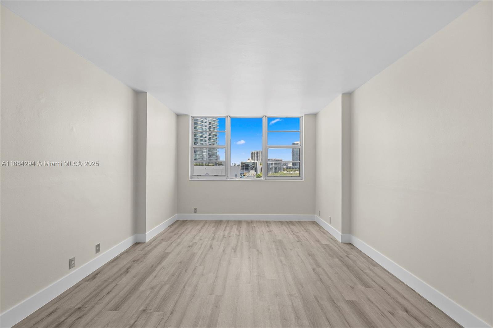 3301 Northeast 5th Avenue, Unit 1018 Miami, FL 33137 - Photo 22 of 24 a view of a kitchen with wooden floor and a kitchen